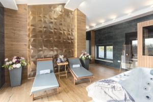 a bathroom with two chairs and a tub at Villa Harmony for 8 people in Central Istria with 50 m2 private pool and sea view in Pinezići