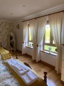 Postel nebo postele na pokoji v ubytování Bayview Guest House