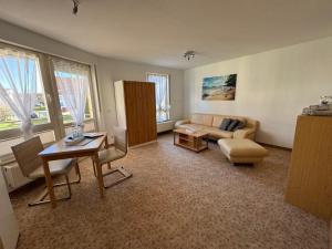 Posezení v ubytování 1 Zimmer Apartment mit Balkon