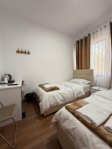 Postel nebo postele na pokoji v ubytování Hotel Kevin