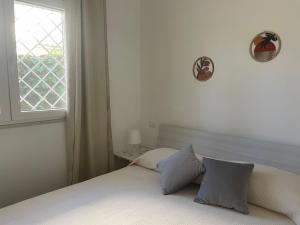 Postel nebo postele na pokoji v ubytování L'Angolo di Grottammare