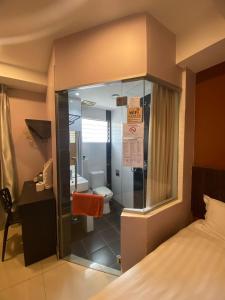 Postel nebo postele na pokoji v ubytování Hotel Vevo Puchong Malaysia