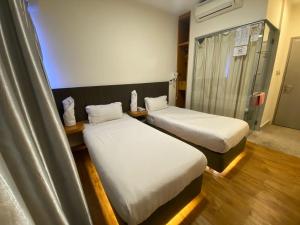 Postel nebo postele na pokoji v ubytování Hotel Vevo Puchong Malaysia + 34 fotografií