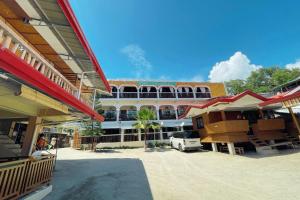 a group of buildings in front of a building at Casa Dolores Laiya Batangas in San Juan