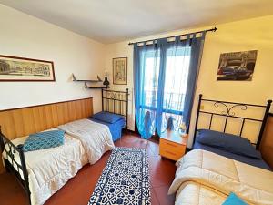 Postel nebo postele na pokoji v ubytování Casale Gelsomino + 37 fotografií
