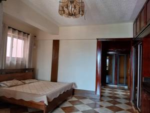 Postel nebo postele na pokoji v ubytování Hotel Acacia View
