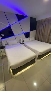 Postel nebo postele na pokoji v ubytování Hotel Vevo Puchong Malaysia