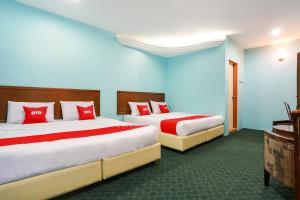 Postel nebo postele na pokoji v ubytování OYO 44094 Bangi Lanai Hotel
