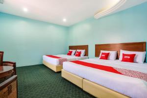 Postel nebo postele na pokoji v ubytování OYO 44094 Bangi Lanai Hotel