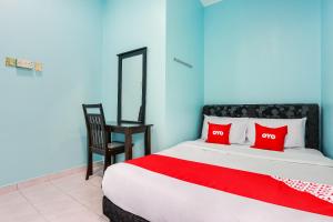 Postel nebo postele na pokoji v ubytování OYO 44094 Bangi Lanai Hotel