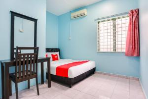 Postel nebo postele na pokoji v ubytování OYO 44094 Bangi Lanai Hotel