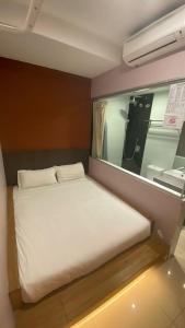 Postel nebo postele na pokoji v ubytování Hotel Vevo Puchong Malaysia