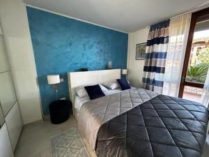 Postel nebo postele na pokoji v ubytování Casale Gelsomino
