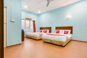 Postel nebo postele na pokoji v ubytování OYO 44094 Bangi Lanai Hotel