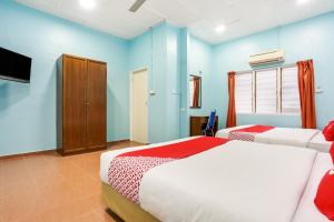 Postel nebo postele na pokoji v ubytování OYO 44094 Bangi Lanai Hotel