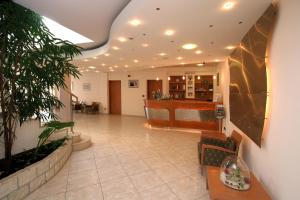 a lobby of a hospital with a waiting room at Hotel Flores in Poreč +58 photos