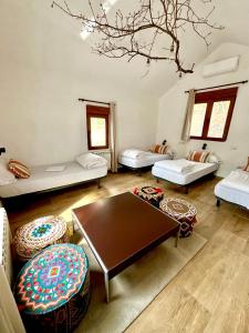 a living room with couches and a table at El Cielo de la Vera in Villanueva de la Vera