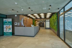 a lobby with a reception desk in a building at Green Port Spa&Wellness Rent Partners in Kołobrzeg +12 photos