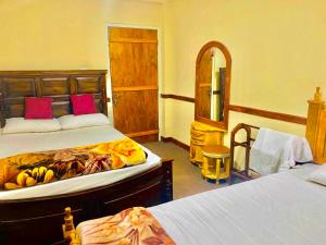 a bedroom with two beds with bananas on them at Niros Homestay Nuwara eliya in Nuwara Eliya