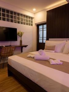 Postel nebo postele na pokoji v ubytování Capricho Villa El Nido + 22 fotografií