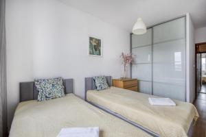 Ένα ή περισσότερα κρεβάτια σε δωμάτιο στο Gama Home Wyspowa 1