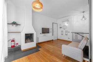 a living room with a chair and a fireplace at Milano-Rho Fiera Exclusive stay private parking in Rho