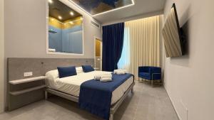 Postel nebo postele na pokoji v ubytování Shanti Rooms & Apartments Lucullo