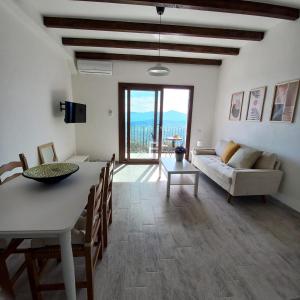 Ruang duduk di WindwoW - Your flat in Baunei