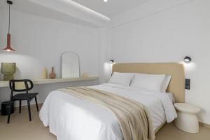 Ένα ή περισσότερα κρεβάτια σε δωμάτιο στο Acropolis Loom Suite