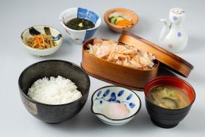 a group of bowls of food on a table at Richmond Hotel Kagoshima Kinseicho in Kagoshima