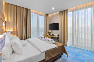 Postel nebo postele na pokoji v ubytování Hotel Diament Plaza Katowice