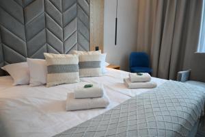 Postel nebo postele na pokoji v ubytování Hotel Centrum Malbork