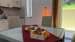 a table in a kitchen with a bowl of food on it at Centro Città 1 in Gorizia