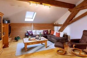 a living room with a couch and a coffee table at Bauernhof Berndlhof Obing in Obing