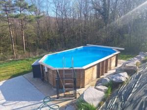 a large swimming pool in a backyard at Le Chalet avec Piscine - Obernai in Obernai +42 photos
