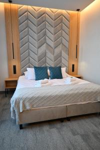Postel nebo postele na pokoji v ubytování Hotel Centrum Malbork