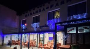 a building with blue lights on the side of it at Hotel Sananda-Farm in Vienna