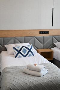Postel nebo postele na pokoji v ubytování Hotel Centrum Malbork