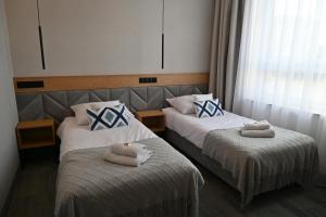 Postel nebo postele na pokoji v ubytování Hotel Centrum Malbork