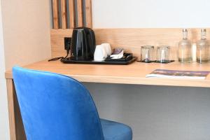 Příslušenství pro přípravu čaje a kávy v ubytování Hotel Centrum Malbork