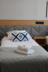 Postel nebo postele na pokoji v ubytování Hotel Centrum Malbork