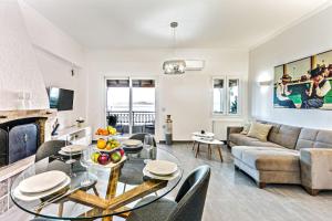 a living room with a couch and a table at Chill Out Apartments Solea in Corfu Town