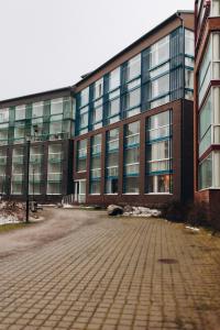 a large brick building with a lot of windows at 2 bedroom apartment, parking, metro, Vantaa in Vantaa