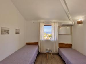 Ένα ή περισσότερα κρεβάτια σε δωμάτιο στο Villa Etoile du lagon +21 φωτογραφίες