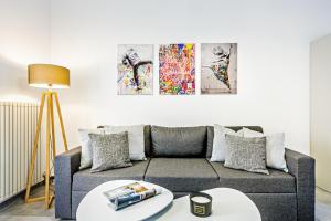 a living room with a couch and a table at Chill Out Apartments Serena in Corfu Town