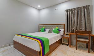 Voodi või voodid majutusasutuse Hotel Abhi Suites toas