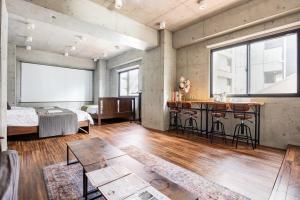 Tempat tidur dalam kamar di 原田屋Hotel 4F