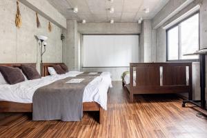 Tempat tidur dalam kamar di 原田屋Hotel 4F