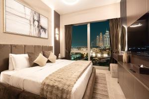 a hotel room with a large bed and a large window at NEW YEARS Luxury Burj Khalifa and Fountain Views in Dubai +98 photos