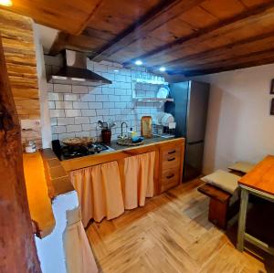 a kitchen with a sink and a stove top oven at Casa los chaparrales mirador in Los Anchos